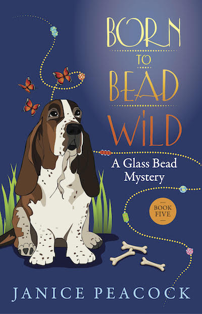 Book cover: Born to Bead Wild: A Glass Bead Mystery by Janice Peacock, with Basset Hound.