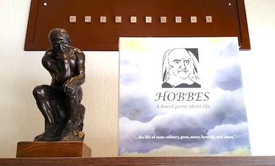 Game box with image of Thomas Hobbes and quote.