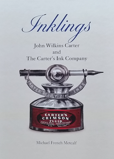Book cover with antique Carter's inkwell.