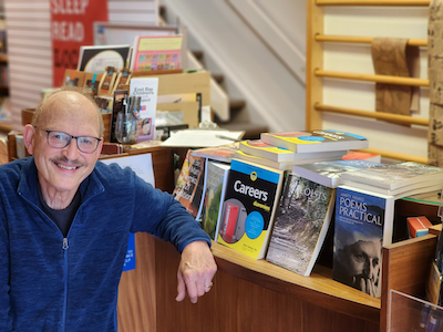 Marty Nemko at Reasonable Books in front of his books including Careers for Dummies.